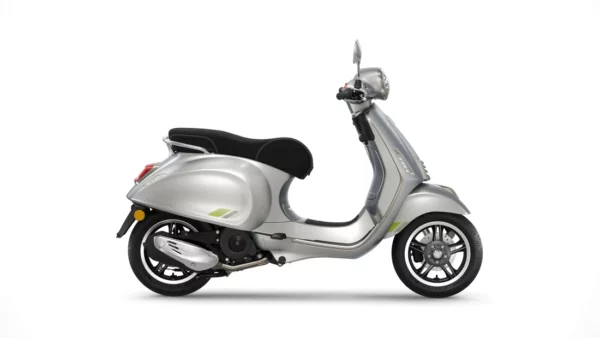 A silver modern scooter with a black seat and green trim accents, displayed in a three-quarter profile view on a white background.