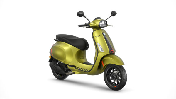 A modern olive green Vespa scooter stands at a three-quarter angle showing the left side of the vehicle, with black trim and seat, on a white background.