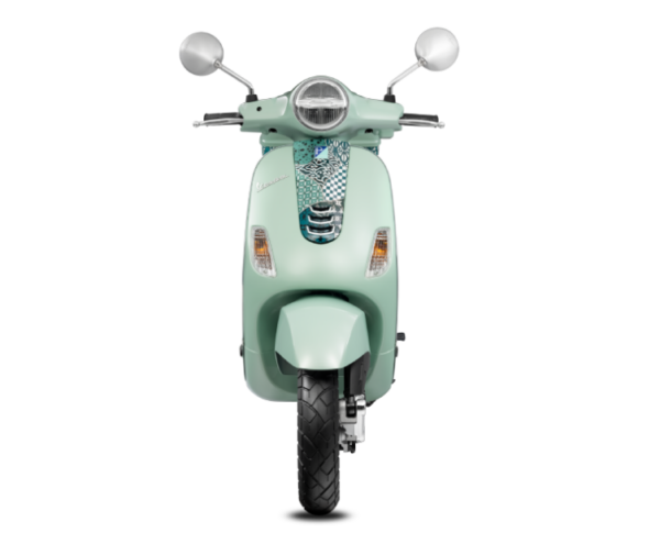 A mint green Vespa scooter seen from the front, against a white background.