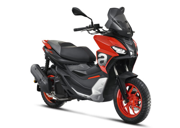 A red and black sporty scooter on a white background, with visible branding, sleek bodywork, and red alloy wheels.