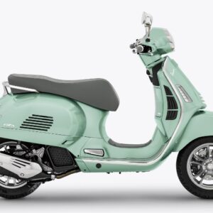 A mint green Vespa scooter positioned at a three-quarter angle on a white background.