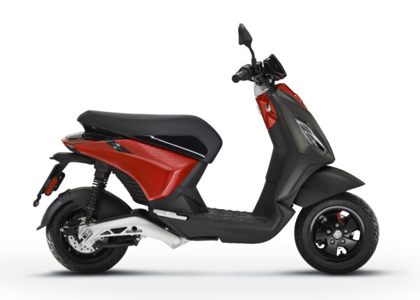 A modern red and black electric scooter against a white background.