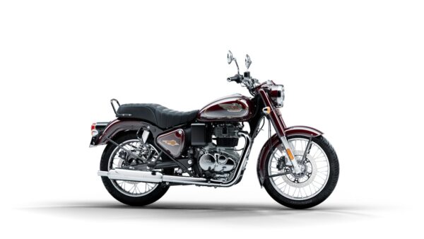 A classic maroon Royal Enfield motorcycle with chrome finishes and black leather seat, isolated on a white background.