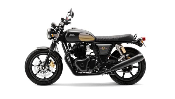 A side view of a black and gold Royal Enfield Interceptor motorcycle against a white background.