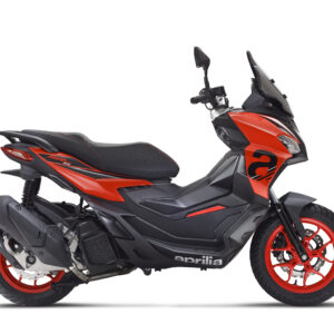 Aprilia SR GT Sport 125 Eu5+ A sleek, modern scooter with a black and orange design, featuring red wheels and an aerodynamic body, parked on a white background.