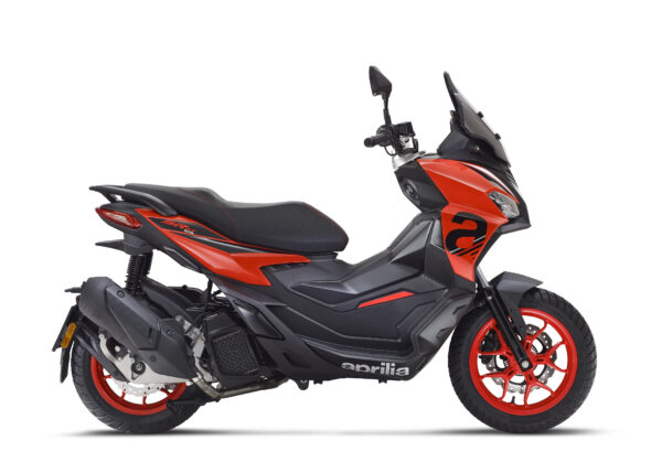 Aprilia SR GT Sport 125 Eu5+ A sleek, modern scooter with a black and orange design, featuring red wheels and an aerodynamic body, parked on a white background.