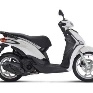 Piaggio Liberty 125 Euro 5+ A sleek, white scooter with a black seat, showcasing a modern design with a small windscreen, side mirrors, and a stylish wheel rim.