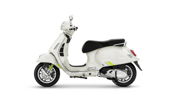 A side view of a white Vespa scooter with a black seat and lime green accents, showcasing its classic design and modern features.