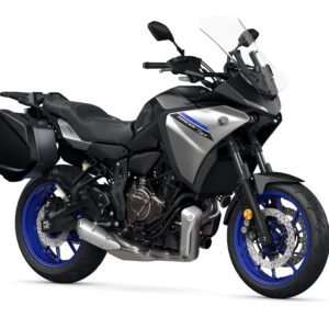 Yamaha 2023 Tracer 7 GT A sleek gray Yamaha Tracer 9 GT motorcycle is shown, featuring blue wheels, a tall windshield, and side luggage. The bike has a sporty design with a prominent engine and modern aesthetics, positioned on a white background.