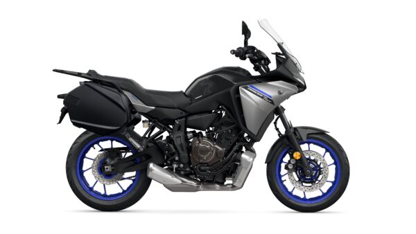 A sleek gray and black sport touring motorcycle with blue rims and a prominent windshield, featuring side panniers and an upright seating position.