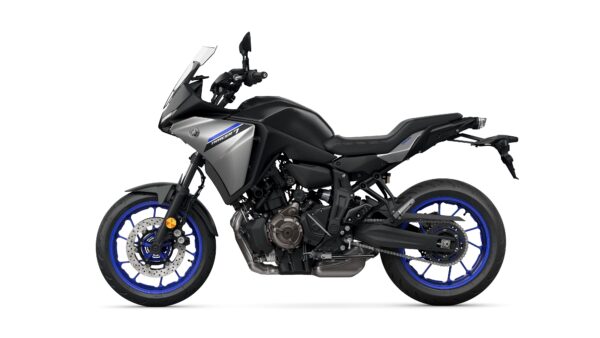 A sleek, modern motorcycle with a matte gray body and blue accents, featuring a sporty design and semi-faired front, viewed from the side.