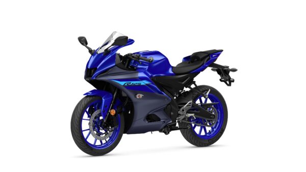 A blue sports motorcycle with a sleek design, featuring a fairing, sporty seating position, and contrasted black accents. The bike is positioned on a white background, showcasing its streamlined shape and detailing.