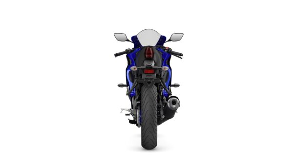 A blue sport motorcycle viewed from the rear, showcasing its sleek design, rear tire, and exhaust pipe against a white background.