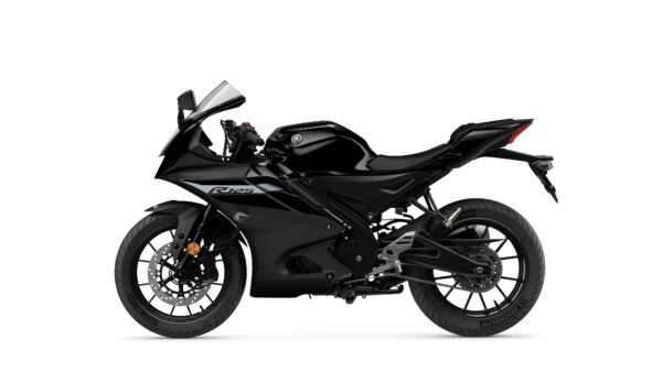 A sleek black sports motorcycle is displayed from the side, showcasing its aerodynamic design, sporty fairing, and large rear tire.