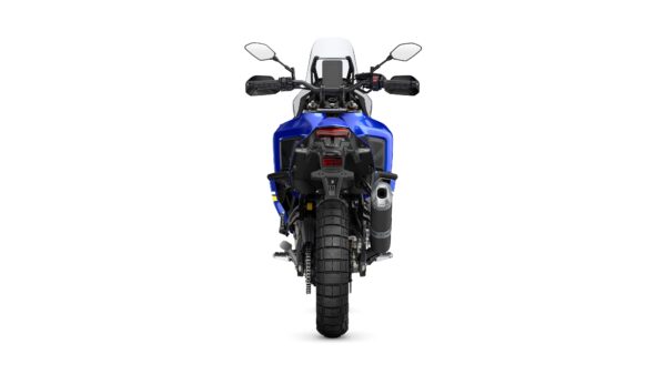 A blue motorcycle is shown from the rear, featuring a prominent rear tire, exhaust, and handlebars. The image has a plain white background.