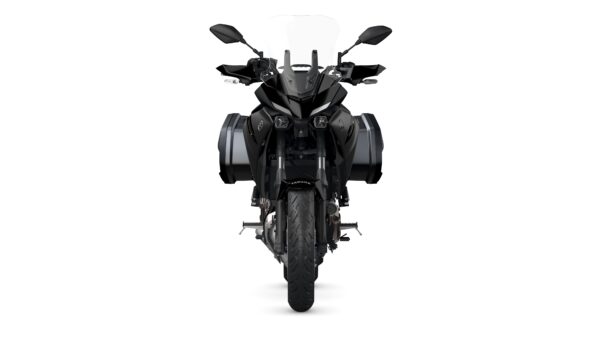 A front view of a black motorcycle with side bags, showing its sleek design and details such as headlights and handlebars against a white background.