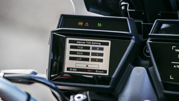 A motorcycle dashboard display showing manual traction control settings, with TCS set to 3, SCS to 1, and LIF to 1, along with an oil indicator and speed reading of 0 km/h. The time displayed is 2:22.