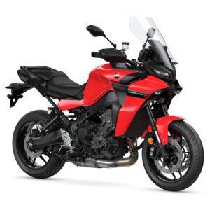 Yamaha 2024 Tracer 9 A red motorcycle with a black seat and detailing, featuring a windshield and sporty design, positioned on a white background.
