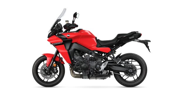 A red sport-touring motorcycle with a sleek design, featuring a large windshield, black seat, and modern handlebars, positioned against a white background.