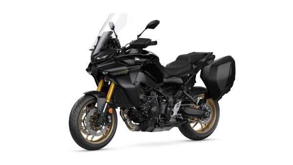 A black motorcycle with gold accents, featuring a windshield, a comfortable seat, and side panniers, positioned at an angle against a white background.