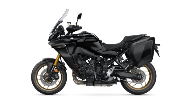 A sleek, black touring motorcycle with gold-accented wheels and saddlebags, displayed against a white background.