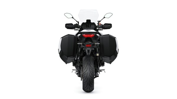 A rear view of a motorcycle with black panniers, a transparent windscreen, and a prominent rear tire, set against a plain white background.