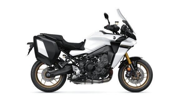 A sleek white motorcycle with black accents and gold wheels, featuring a large windshield and side panniers, displayed on a white background.