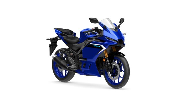 A sleek blue sport motorcycle positioned at an angle, showcasing its aerodynamic design, dual front headlights, and detailed bodywork. The bike features black accents and a gold front fork, highlighting its performance-oriented features.