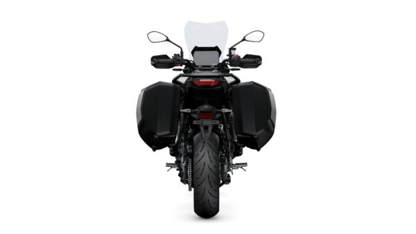 Rear view of a motorcycle with a black body, side bags, and a visible rear tire, set against a white background.