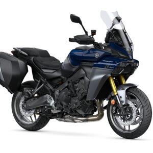 Yamaha 2025 TRACER 9 GT+ Y-AMT A blue Yamaha motorcycle, model Tracer 9 GT, featuring a sleek design, a tall windshield, and a single side case. The bike is positioned on a white background, showcasing its modern aesthetic and dual front headlights.
