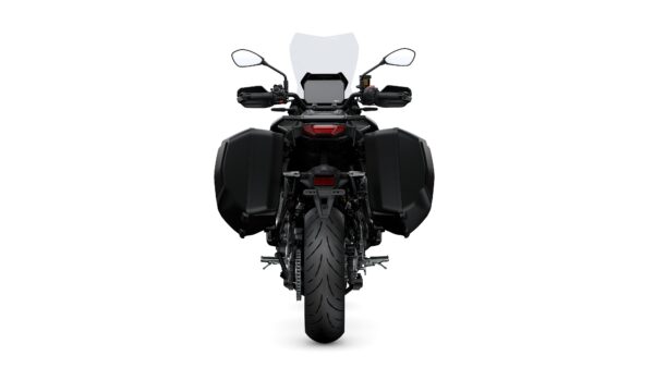 A rear view of a motorcycle featuring a sleek design, two side panniers, a prominent rear tire, and a transparent windscreen.