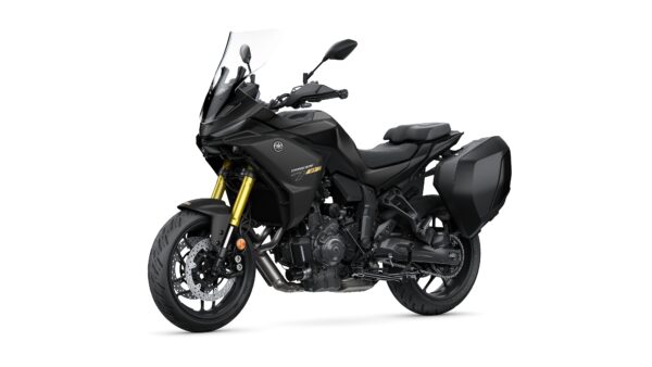 A sleek black touring motorcycle with gold front forks, a windshield, and side panniers, positioned at an angle to showcase its design and features.