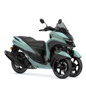 Yamaha 2025 Tricity 125 A modern teal and black three-wheeled scooter, featuring a sleek design with a windscreen, sporty handlebars, and dual front tires.