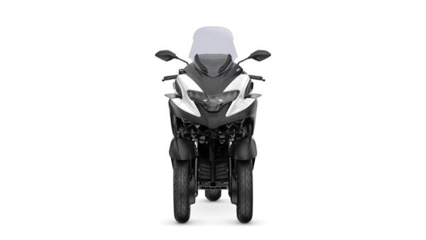 A front view of a modern three-wheeled motorcycle with a sleek design, featuring a prominent windshield and distinct lighting elements.