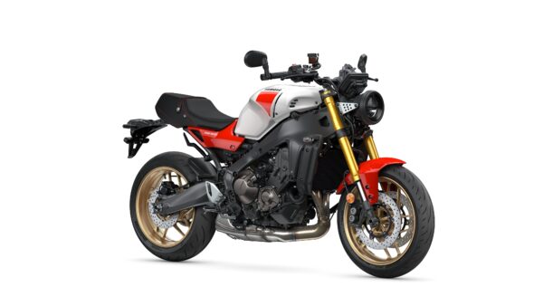 Yamaha 2025 XSR900 A modern motorcycle with a silver and red body, gold wheels, and a sleek design, displayed against a white background.