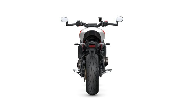 Rear view of a modern motorcycle showcasing the large tire, tail section, and handlebars with mirrors, set against a white background.