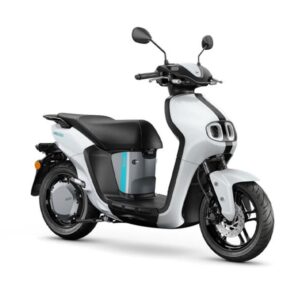 Yamaha 2023 Neos Dual Battery A modern electric scooter with a sleek white body, brown seat, black tires, and distinctive front headlights.