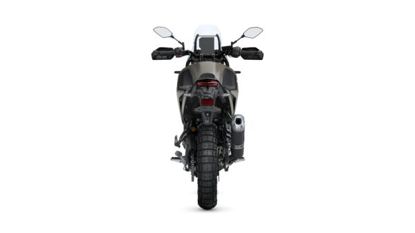 A rear view of a modern motorcycle with a rugged tire, dual rear lights, and a silver exhaust pipe, set against a plain white background.