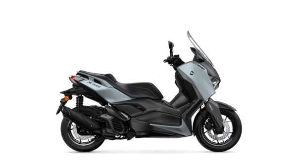A sleek gray scooter with a modern design, featuring a prominent front windshield, a comfortable seat, and black accents, shown from the side against a white background.