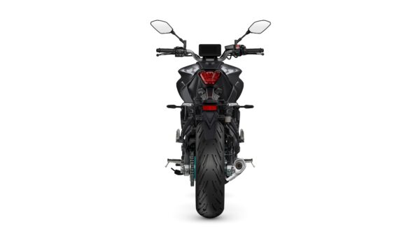 A rear view of a modern motorcycle showcasing its sleek design, features a prominent tire, dual rear mirrors, and a digital display on the handlebars.