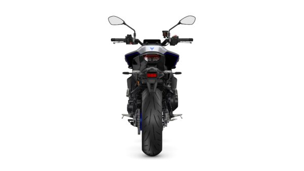 A rear view of a modern motorcycle with a sleek design, featuring a prominent rear tire, dual exhausts, and modern handlebar controls. The body is predominantly black with silver and blue accents.