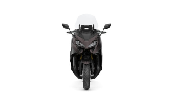 A front view of a sleek, dark-colored motorcycle with a transparent windscreen, showcasing its streamlined design and robust tire.