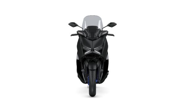 A sleek, black motorcycle facing forward, featuring a large windshield, angular headlights, and a robust front tire.