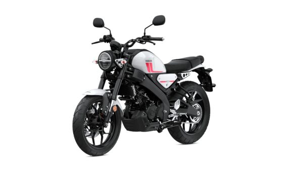 A modern gray and black motorcycle with a minimalist design, featuring a round headlight, sleek body lines, and a low seat, positioned at a dynamic angle.