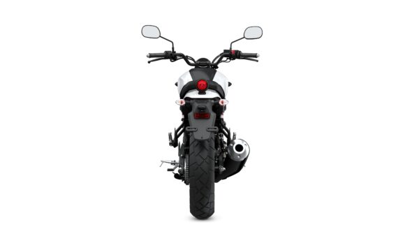 A rear view of a motorcycle with a black and white design, featuring handlebars, mirrors, a round red taillight, and a large rear tire with a shiny exhaust pipe.