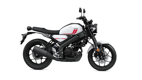 A sleek white and black Yamaha motorcycle is shown from the side, featuring a minimalist design with red accents, a low seat, and stylish wheels.