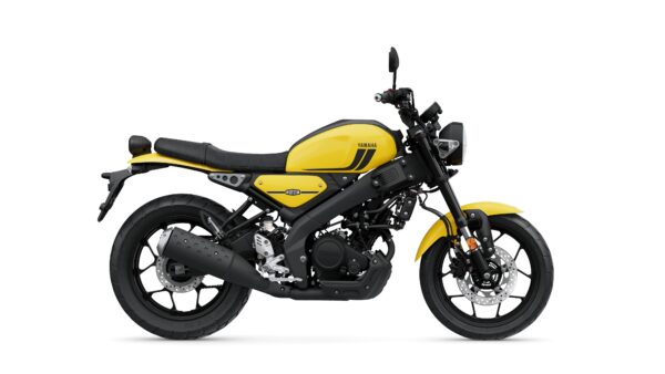 A yellow Yamaha motorcycle with a sleek design, featuring a black seat, exposed engine components, and modern handlebars, positioned against a white background.