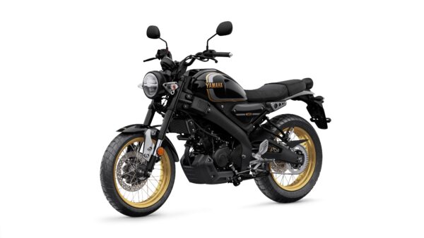 A black Yamaha motorcycle with gold accents, featuring a round headlight, a flat seat, and a rugged tire design, positioned at an angle to showcase its modern styling.