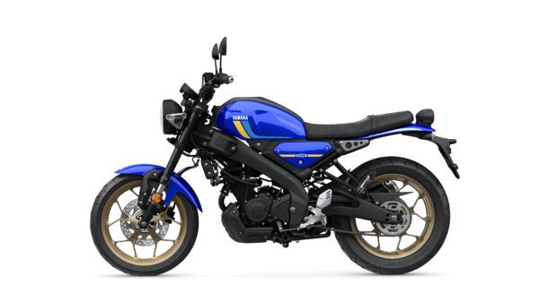 A blue Yamaha motorcycle with a modern design, featuring a black seat and gold alloy wheels, shown from the side against a white background.