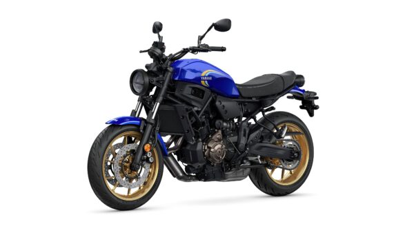 A blue Yamaha motorcycle with golden wheels, featuring a sleek design and a black seat, positioned against a white background.